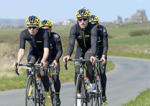 JLT Condor Cycling Team riders Tom Moses, Chris Lawless, Stephen Williams and Graham Briggs, climb away from Whitby Abbey during of their recce of the third stage of the Tour de Yorkshire from Middlesborough to Scarborough.  (Picture: Bruce Rollinson)