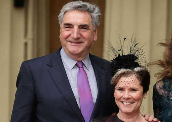 Actress Imelda Staunton poses with her husband Jim Carter after she received a CBE from the Duke of Cambridge for services to drama at an investiture ceremony at Buckingham Palace. Yui Mok/PA Wire