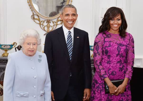 Queen Elizabeth II  (left) stands with the President and First Lady of the United States Barack Obama and his wife Michelle, in the Oak Room at Windsor Castle ahead of a private lunch hosted by the Queen.