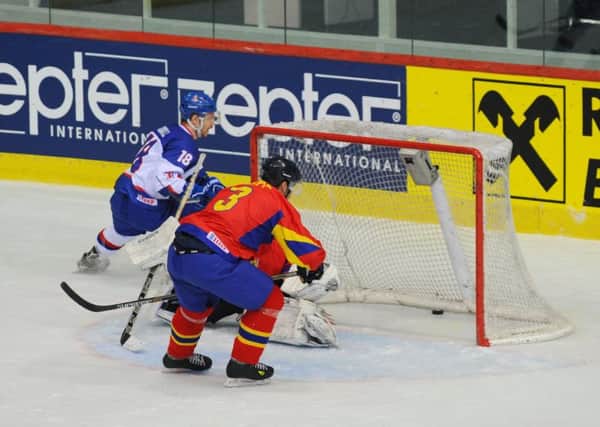 Jonathan Boxill scores GB's second goal against Romania on Friday. Picture: Colin Lawson.