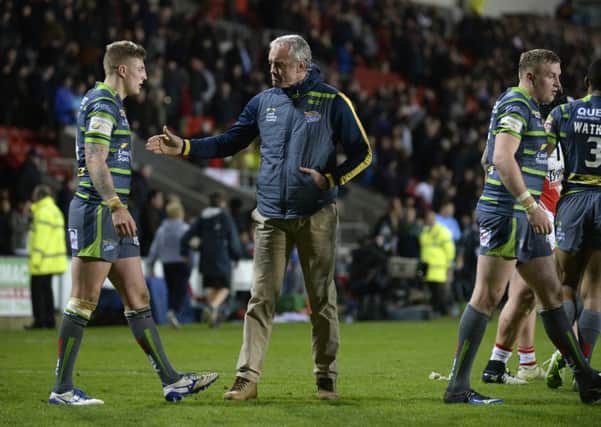 Leeds Rhinos' head coach Brian McDermott consoles Liam Sutcliffe at full time after their side's 38-34 defeat at 
St Helens.  Picture: Bruce Rollinson