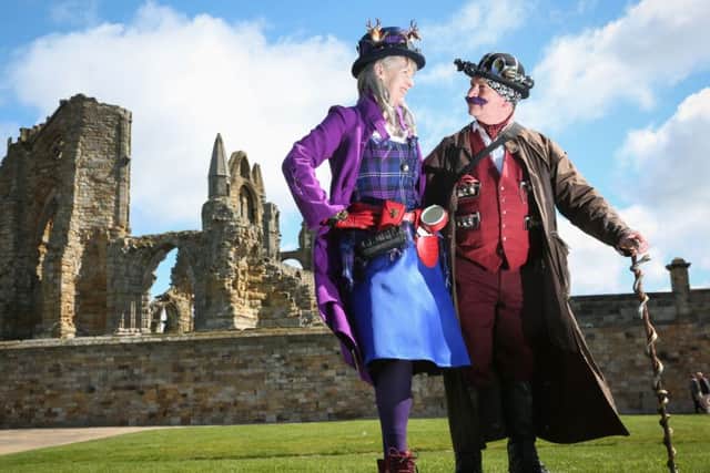 Mark and Evelyn Johnson from Kendal wore matching purple outfits at the Whitby Goth Weekend 2016.  April 23 2016. Picture: Ceri Oakes w161750d