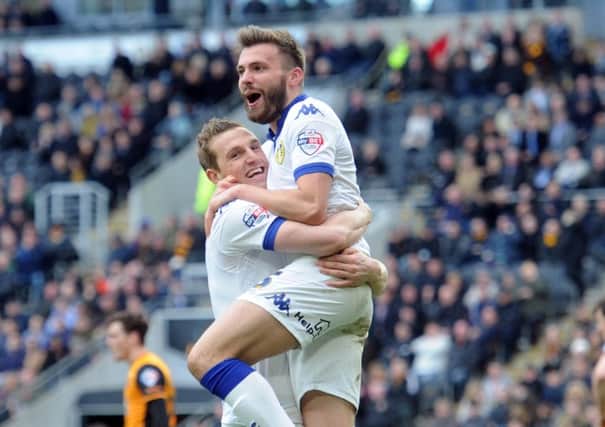 Stuart Dallas is hugged after netting his late equaliser for Leeds United against Hull City (Picture: Simon Hulme).