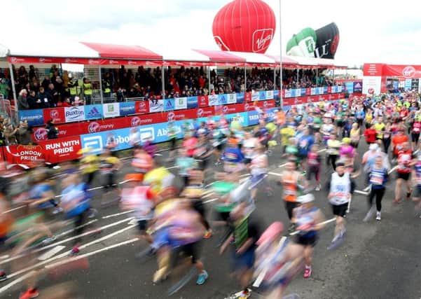 Runners cross the start line during the 2016 Virgin Money London Marathon. PRESS ASSOCIATION Photo. Picture date: Sunday April 24, 2016. See PA story ATHLETICS Marathon. Photo credit should read: Adam Davy/PA Wire