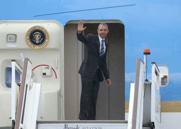 US President Barack Obama waves as he departs from London Stansted Airport following his visit to the UK.