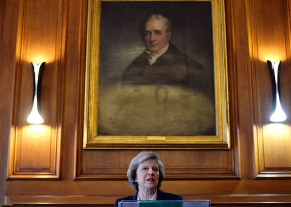 Home Secretary Theresa May delivers a speech on Great Britain, Europe and our place in the world under a portrait of George Stephenson, the first president of the Institute of Mechanical Engineers, at One Birdcage Walk in Westminster, London.