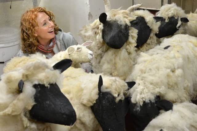Joanna Jefferies with some of the model sheep to  be used in the York Mystery Plays  inside York Minster.