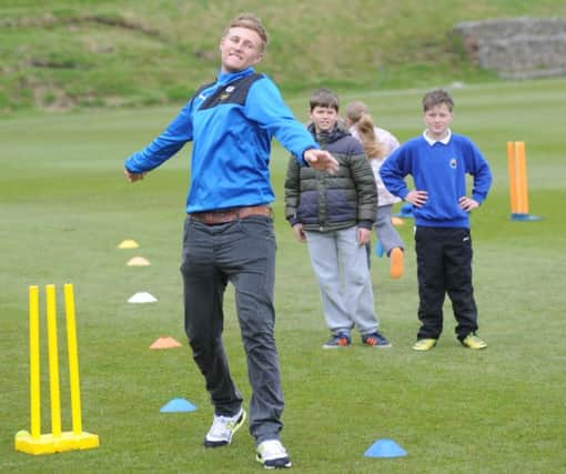 Yorkshire and Englands Joe Root demonstrates his bowling yesterday at Abbeydale Sports Club (Picture: Scott Merrylees).