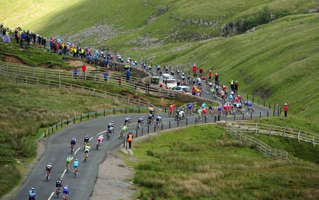 The crowds gathered on Buttertubs Pass was one of the iconic moments of the Tour de France which has put Yorkshire on the international cycling map.