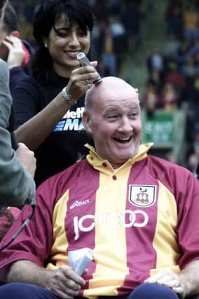 Sky presenter Rodney Marsh having his head shaved at Valley Parade.