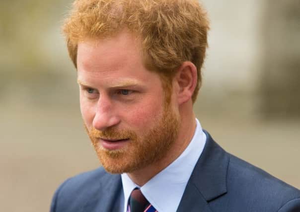Prince Harry leaves Westminster Abbey, London, after attending a service held as part of Anzac Day commemorations in the UK on Monday. Picture: Dominic Lipinski/PA Wire