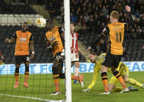 Hull Citys Mo Diame scores his sides second goal against Brentford after visiting goalkeeper David Button had saved his initial effort (Picture: Bruce Rollinson).