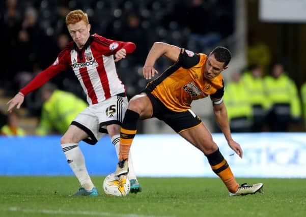 Brentford's Ryan Woods (left) and Hull City's Jake Livermore challenge during the Sky Bet Championship match at the KC Stadium, Hull. (Picture: PA)