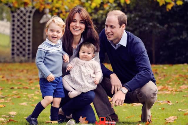 The Duke and Duchess of Cambridge with their two children, Prince George and Princess Charlotte, in a photograph taken late October at Kensington Palace in London. Photo: Chris Jelf/PA Wire