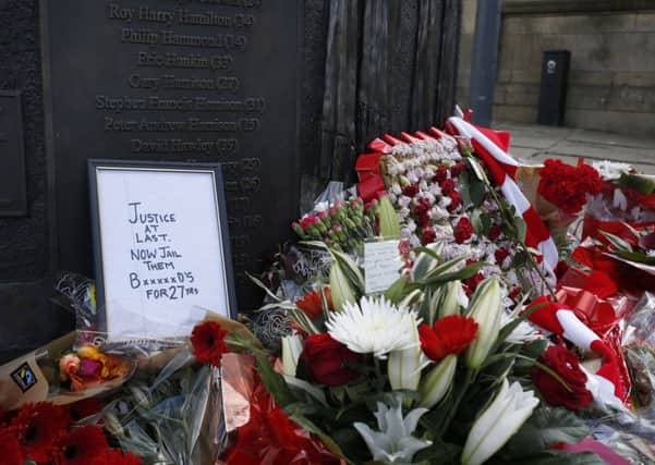 Floral tributes left at a Hillsborough memorial in Old Haymarket, Liverpool.