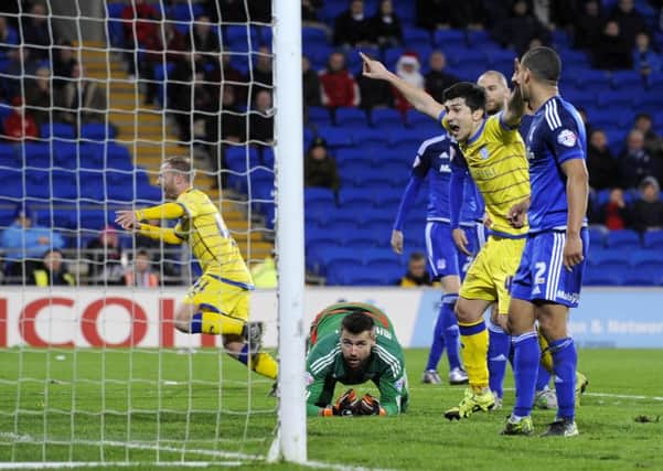 Sheffield Wednesday's players celebrate Barry Bannan's, left, equalising goal at Cardiff City back In December.