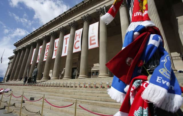 A giant banner at St George's Hall in Liverpool, with a candle lit for each of the 96 Liverpool fans who died as a result of the Hillsborough disaster, after an inquest jury ruled they were unlawfully killed, triggering calls for further action. Photo : Peter Byrne/PA Wire