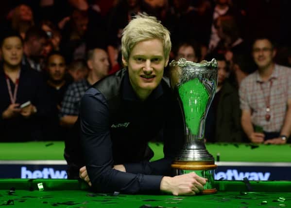 Neil Robertson celebrates with the UK Snooker Championship trophy at York's Barbican Theatre last year. Picture: Anna Gowthorpe/PA Wire.