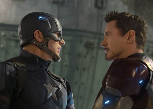 Tony Stark/Iron Man (Robert Downey Jr.) and Steve Rogers/Captain America (Chris Evans) in Captain America: Civil War. Photo/Marvel.
