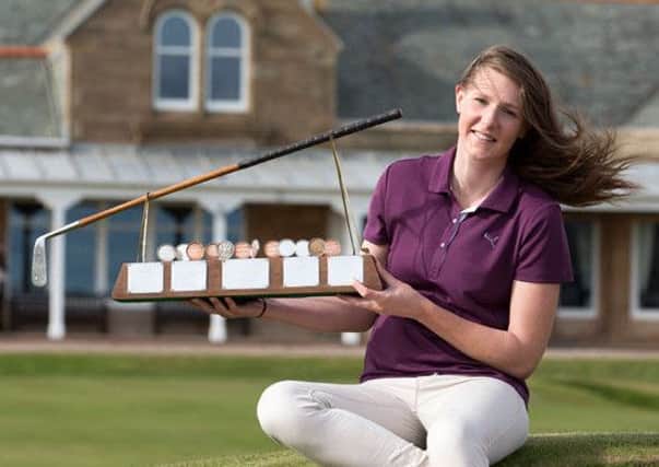 Rotherham GC's Olivia Winning with the Helen Holm Scottish women's open stroke play championship trophy at Royal Troon GC.