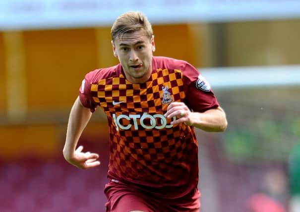 STEVEN DAVIES: Suspended striker is left to hope that his team-mates can get Bantams into the play-offs. Picture: Simon Hulme