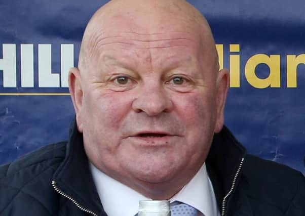 Racehorse trainer David "Dandy" Nicholls will appear in court charged with sexually assaulting a woman.