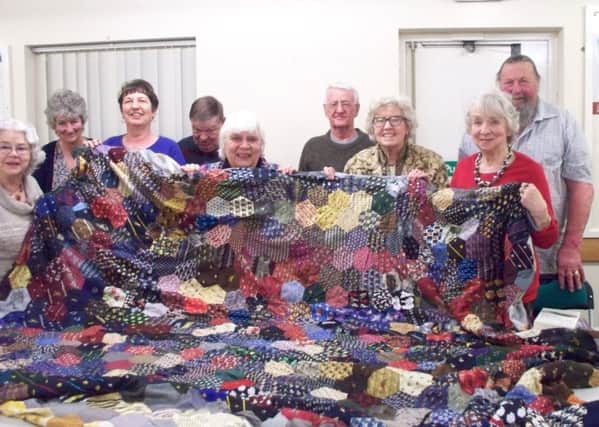 The Bridlington Writers with Sues complete patchwork quilt made from ties.
