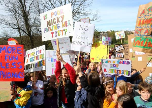 Parents hold a rally with their children in Preston Park, Brighton, in protest at controversial Sats tests for six and seven-year-olds.