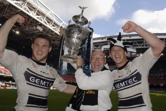 John Kear, centre, celebrates winning the Challenge Cup in 2005 with Hull FC, flanked by players Kirk Yeaman and Richard Hirne, right
. Picture: Gerard Binks.