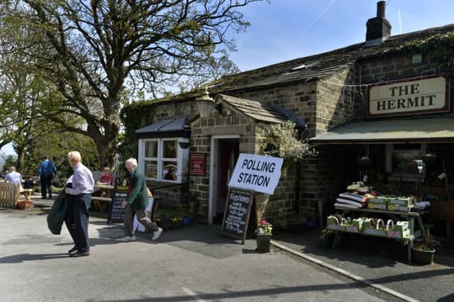 Voters post their ballots in the spring sunshine at The Hermit pub in Burley Woodhead, near Ilkley