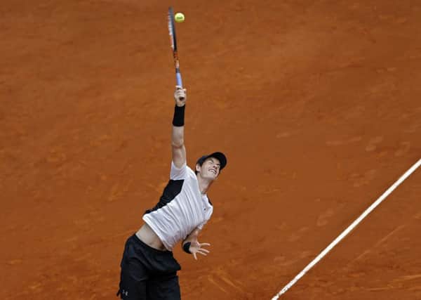 Andy Murray, from Britain, serves against Gilles Simon, on his way to a 6-4 6-2 win at the Madrid Open.  Picture: AP/Francisco Seco.