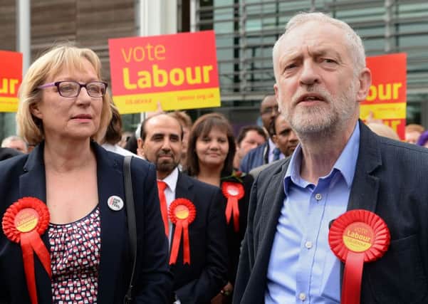 Jeremy Corbyn stands with Gill Furniss, whose husband, Harry Harpham, died from cancer, and who won the by-election to replace him in Sheffield Brightside and Hillsborough