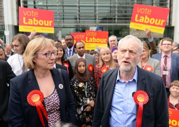 Labour party leader Jeremy Corbyn stands with Gill Furniss, whose husband Harry Harpham died from cancer, and who won the by-election to replace him in the Sheffield Brightside and Hillsborough parliamentary constituency.