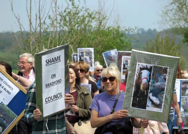 Protesters gather outside the travellers' site at Esholt