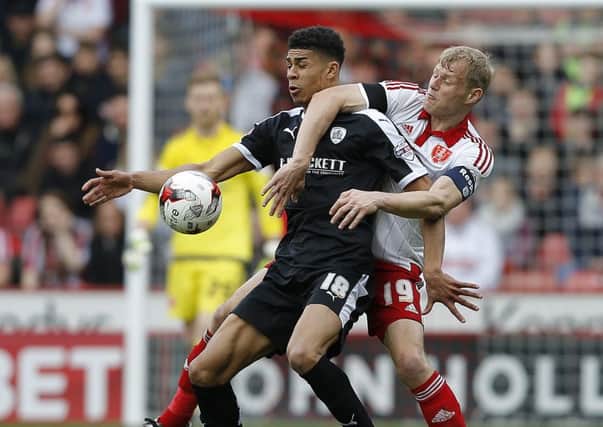 Ashley Fletcher, left, in action against Sheffield United, has impressed during his loan spell at Barnsley. (Picture: Sport Image)
