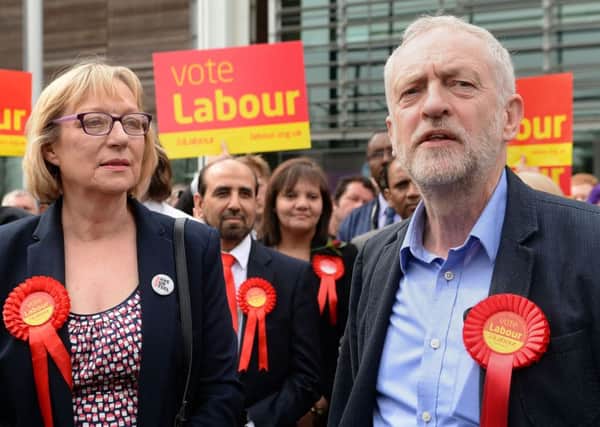 Labour party leader Jeremy Corbyn stands with Gill Furniss, whose husband, Harry Harpham, died from cancer, and who won the by-election to replace him in the Sheffield Brightside and Hillsborough parliamentary constituency. PIC: PA