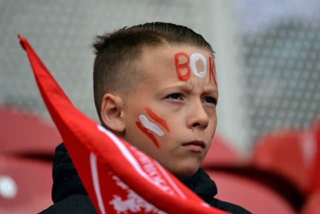 A Middlesbrough fan waits for kick off.