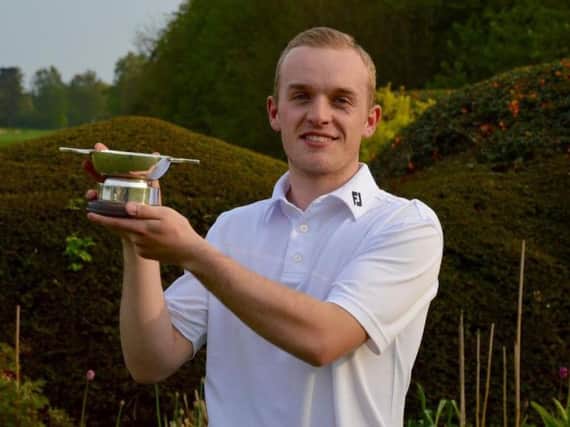 The Oaks GC's Sam Wilkinson with the Thompson Trophy.