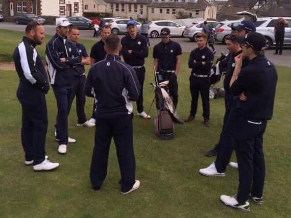 Yorkshire captain Darryl Berry, back to camera, talks to his side at Seascale GC where they faced Cumbria.