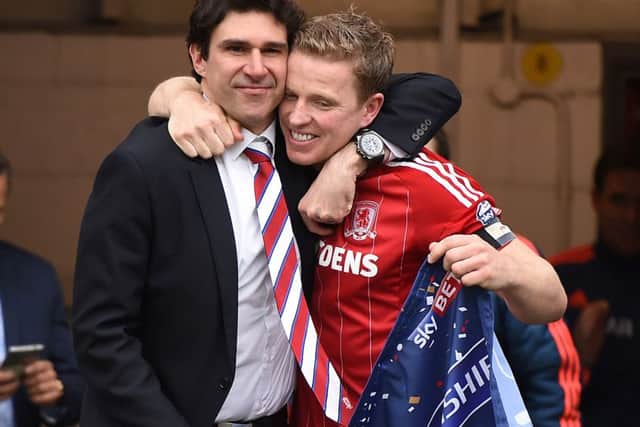 Middlesbrough's Grant Leadbitte  and manager Aitor Karanka enter the field after winning promotion the Sky Bet Championship match at the Riverside Stadium, Middlesbrough.