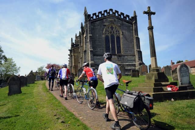 Cyclists arrive at the service.