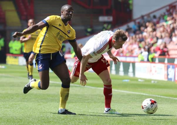 Hakeeb Adelakun of Scunthorpe tussles with Martyn Woolford of Sheffield United Picture: Sportimage