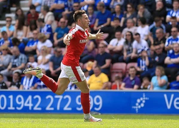 Barnsley's Josh Brownhill celebrates scoring his side's fourth goal of the game against Wigan. Walsall now await in the play-offs. Picture: Nigel French/PA.