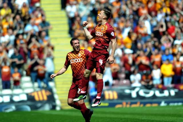 Bradford's Lee Evans celebrates his opening goal with Rory McArdle.
 Picture : Jonathan Gawthorpe