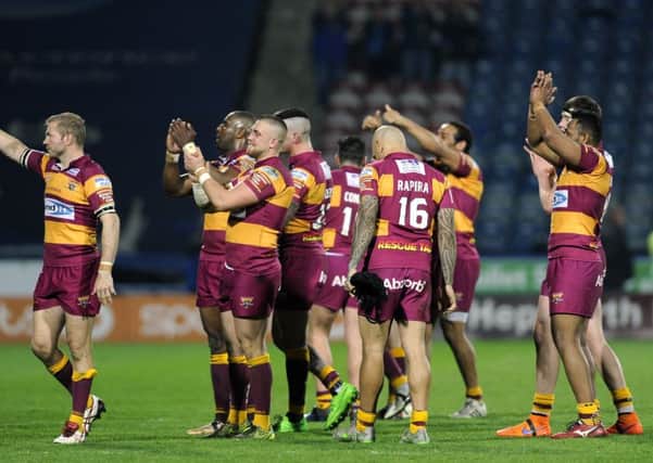 The Huddersfield Giants players celebrate at the final hooter. (Picture: Bruce Rollinson)