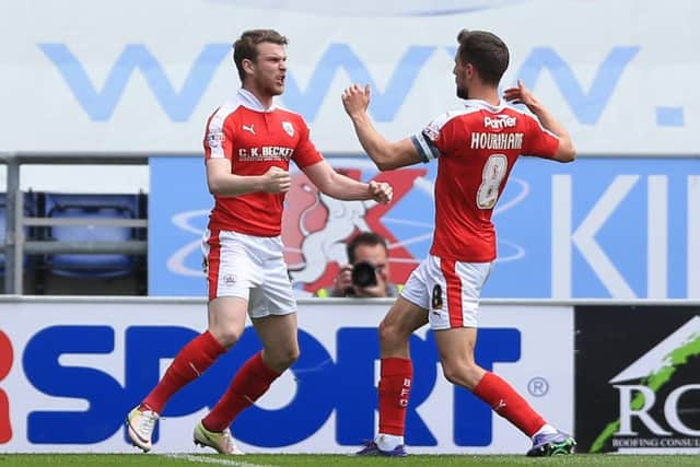 Barnsley's Sam Winnall (left) celebrates scoring his side's first goal of the game from the penalty spot with team-mate Conor Hourihane. Picture: Nigel French/PA.