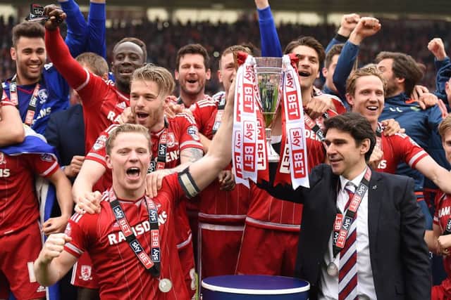 Middlesbrough Grant Leadbetter lifts the cup with Aitor Karanka. Picture: PA.