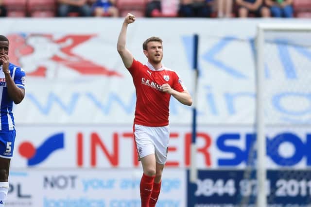 Barnsley's Sam Winnall celebrates scoring his side's first goal against Wigan on Sunday. Picture: Nigel French/PA.