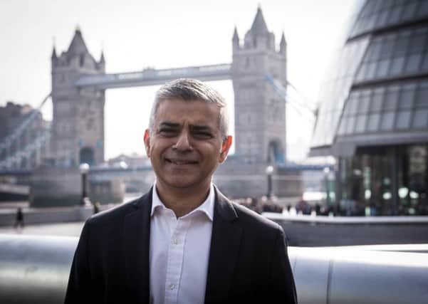 Mayor of London Sadiq Khan makes his way to City Hall from London Bridge Station in London, on his first day as mayor.