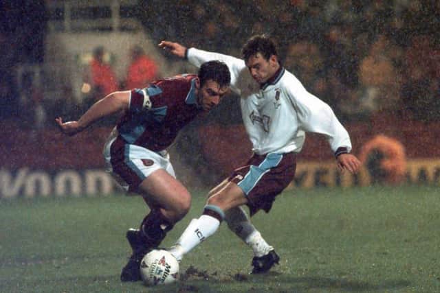 West Ham United's David Unsworth (left) and Emley's Deinoi Graham fight for the ball during their FA Cup tie in January 1998. The Hammer won, just, 2-1.